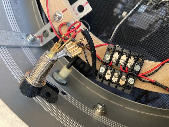 You can see where the piezo cable enters the shell under the 1/4&quot; output connector for connection to the terminal strip.